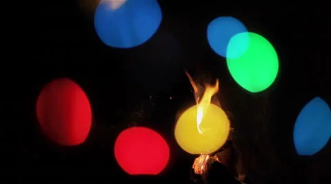 Fire in fireplace with colorful bokeh of party lights Stock Footage 46372053