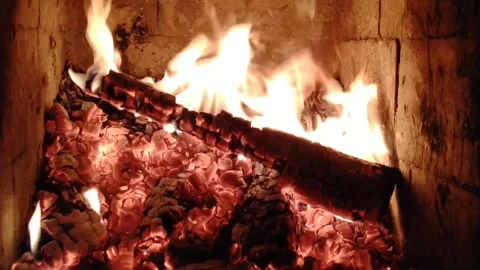 Fire in the fireplace. The concept of wood heating in the house Stock Footage 196149870