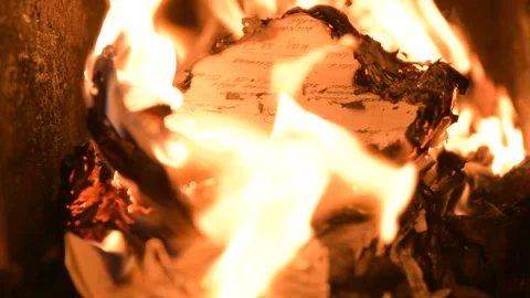 Fire fireplace in dark burning wood letters books Stock Footage 145415089