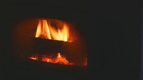 Fire in the fireplace in a dark room - close up Video stock 122848698