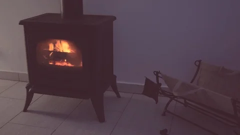 Fire in the fireplace in a dark room 스톡 동영상 122848756