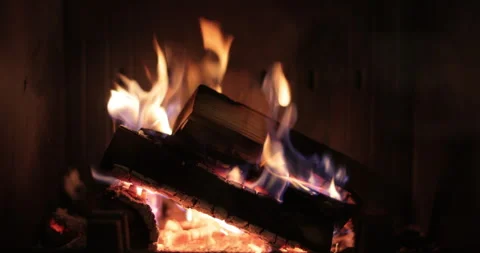 Fire in the fireplace. Flame of fire. Wood heating. Scene is cozy and warm. Stock Footage 318219502
