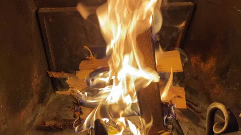 Fire in fireplace at hpme in chalet Stock Footage 145814499
