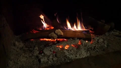 Fire in the fireplace in the mountain Video stock 218445652