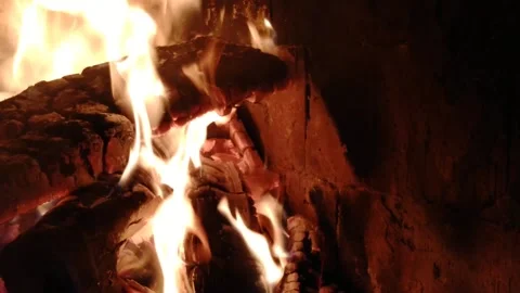 Fire in the fireplace in the winter house Stock Footage 220557030