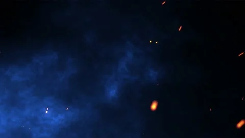 Fire flakes moving towards the blue sky with the feeling of a fire happening. 4k Stock Footage 239090634