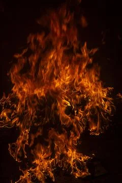 Fire flame background. Hell bonfire. Texture of fire on a black background. A Foto stock