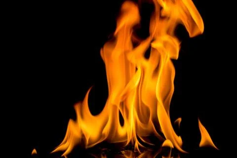 Fire flame on black background. Blaze fire flame textured background. Stock Photos