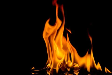Fire flame on black background. Blaze fire flame textured background. Stock Photos