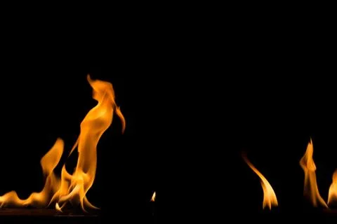 Fire flame on black background. Blaze fire flame textured background. Stock Photos