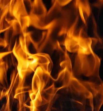 Fire flame on black background Stock Photos