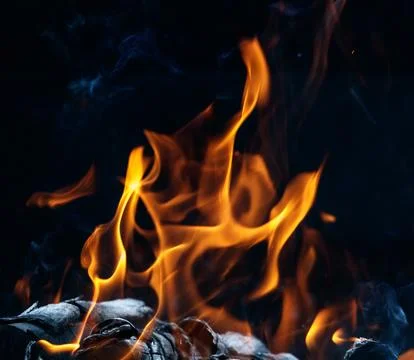 Fire flame on black background Stock Photos