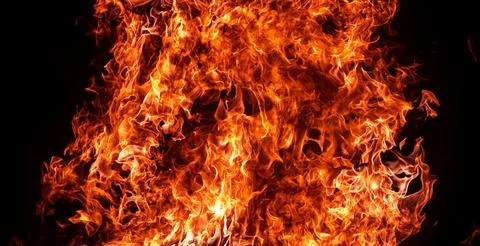 Fire flame bright on black. Fire texture with burning blaze. Fire flames ri.. Stock Photos