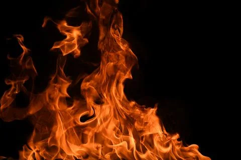 Fire flame. Burn lights on a black background. Stock Photos