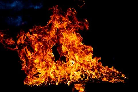Fire flame burning and fire glowing on black background. Stock Photos