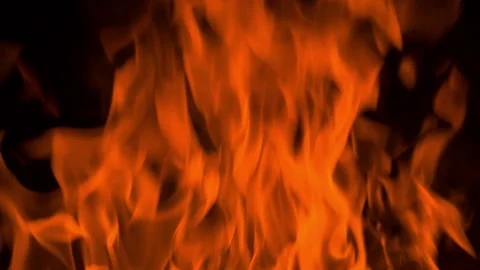 Fire flame burning and glowing on dark black background Stock Footage 246932503