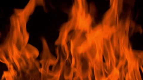 Fire flame burning and glowing on dark black background Stock Footage 246932783