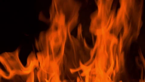 Fire flame burning and glowing on dark black background Stock Footage 246932836