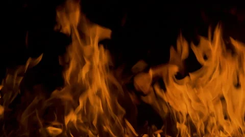 Fire flame burning and glowing on dark black background Stock Footage 246936174