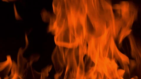 Fire flame burning and glowing on dark black background Stock Footage 246936539