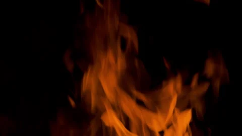 Fire flame burning and glowing on dark black background Stock Footage 246936703