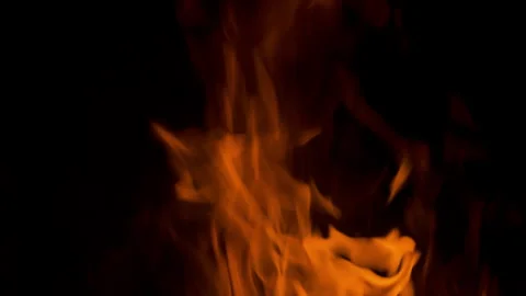 Fire flame burning and glowing on dark black background Stock Footage 246936768