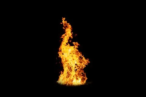Fire flame burning isolated on dark background. Abstract fireplace burning light Stock Photos