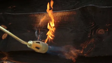 Fire flame burns a wooden surface. Stock Footage 80198445