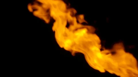 Fire flame bursting in one direction, isolated on black Stock Footage 82634039
