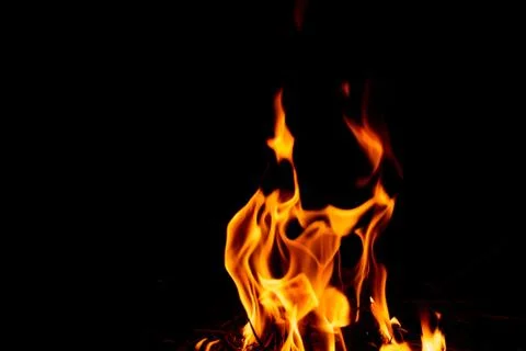 Fire flame on dark background. Stock Photos