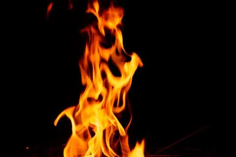Fire flame on dark background. Stock Photos