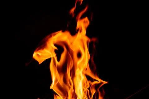 Fire flame on dark background. Stockfoto's