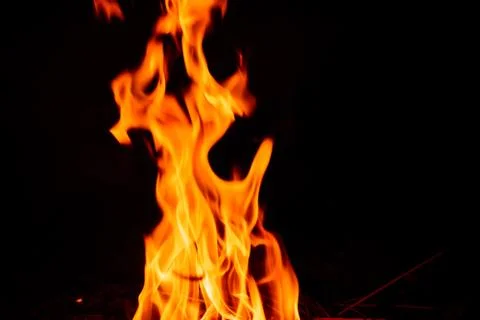 Fire flame on dark background. Stock Photos