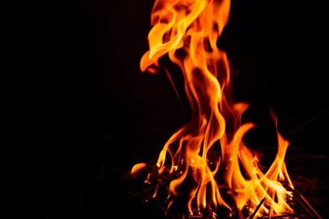 Fire flame on dark background. Stockfoto's