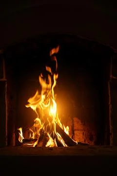 Fire flame in the fireplace. Stock Photos
