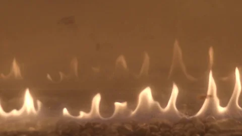 Fire flame Flames in a Modern Fireplace roaring gas burning indoor at night Video stock 84838314