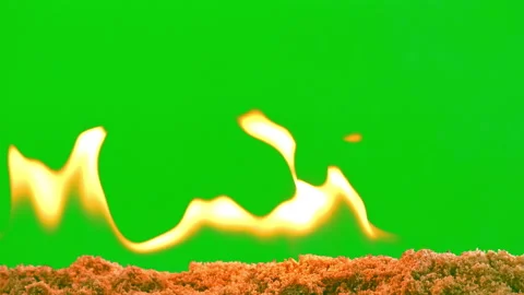 Fire flame glowing slow motion on sand of green screen background Stock Footage 239554622