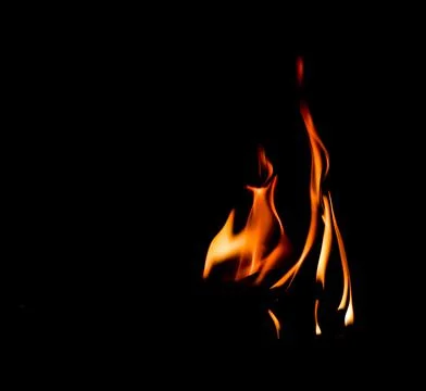 Fire flame isolated on black background. Space for copy Stock Photos