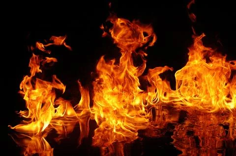 Fire flame isolated on black background Stock Photos