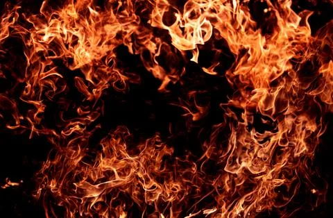 Fire flame texture. Fire sparks. Fire inferno. Fire glowing effect. Stock Photos