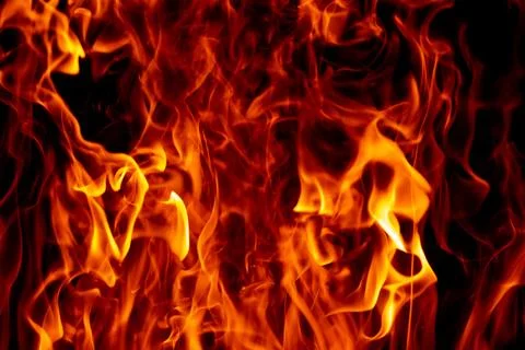 Fire flame texture. Fire sparks. Fire fiery effect. Fire on black background. Stock Photos