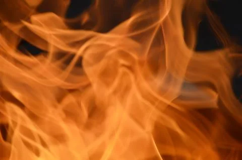 Fire flame texture. Flashes of orange flame. Abstract background for banner. Stock Photos