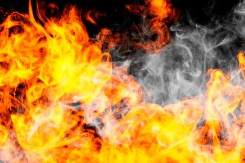 Fire flames background. Cloud of  fiery smoke on a black isolated background. Foto stock
