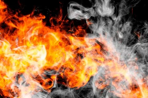 Fire flames background. Cloud of  fiery smoke on a black isolated background. Stock Photos