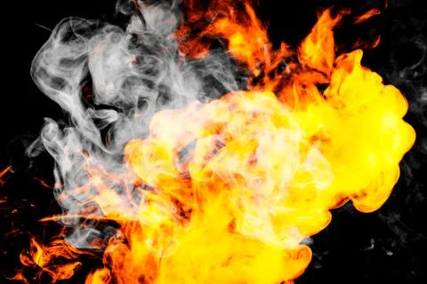Fire flames background. Cloud of  fiery smoke on a black isolated background. Stock Photos