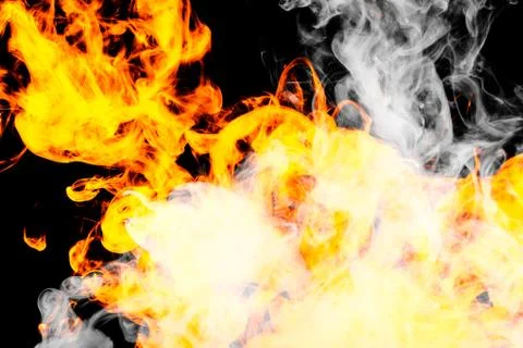 Fire flames background. Cloud of  fiery smoke on a black isolated background. Stock Photos