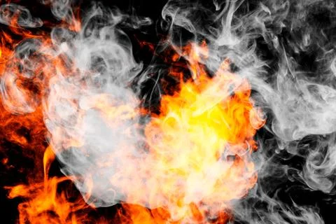 Fire flames background. Cloud of  fiery smoke on a black isolated background. Foto stock