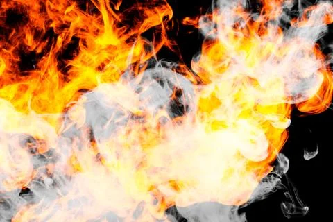 Fire flames background. Cloud of  fiery smoke on a black isolated background. Stock Photos