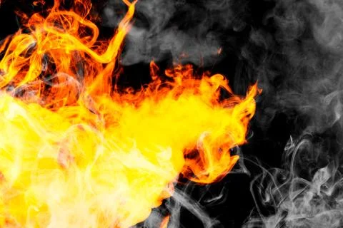 Fire flames background. Cloud of  fiery smoke on a black isolated background. Stock Photos