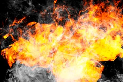 Fire flames background. Cloud of  fiery smoke on a black isolated background. Foto stock